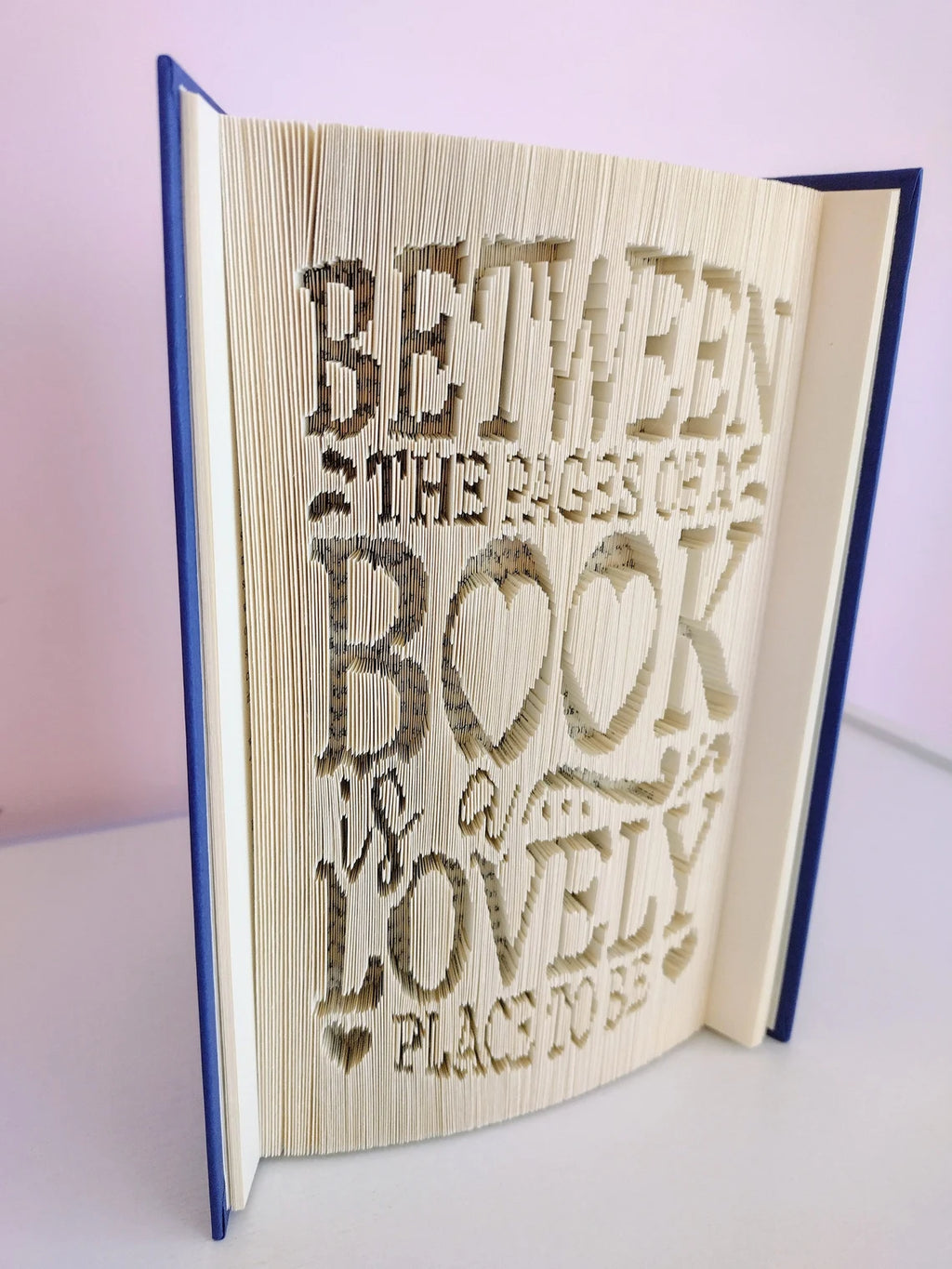 Between the Pages of a Book is a Lovely Place To Be Folded Book Art