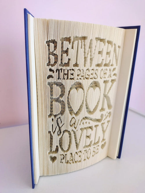 Between the Pages of a Book is a Lovely Place To Be Folded Book Art