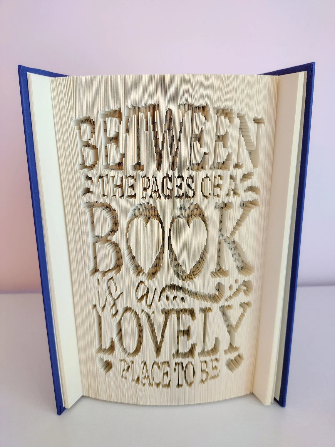 Between the Pages of a Book is a Lovely Place To Be Folded Book Art